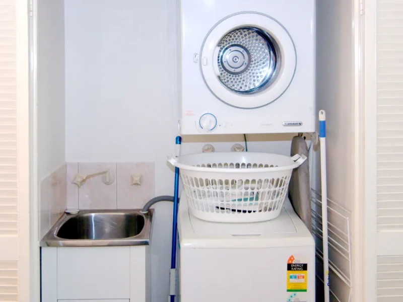 2 Bedroom Laundry at cable beach apartments with washer, dryer and sink